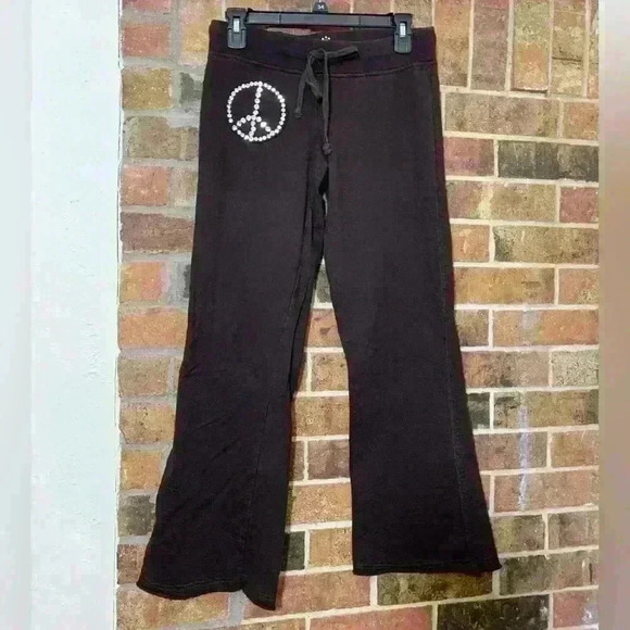 Twisted Heart Brown low-rise rhinestone peace sign flare pants